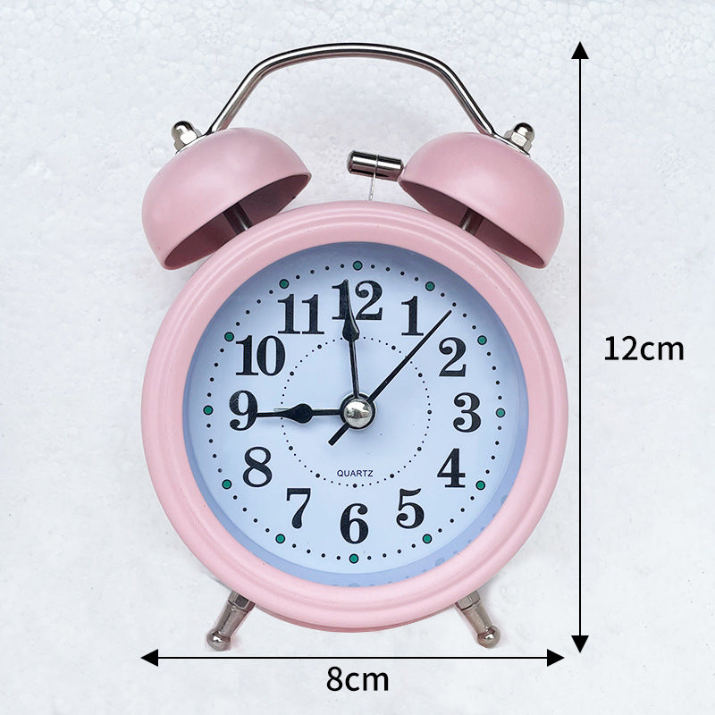 pink color ringing alarm clock